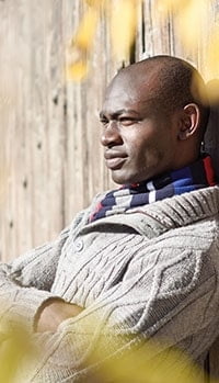 Black man wearing casual clothes in urban background