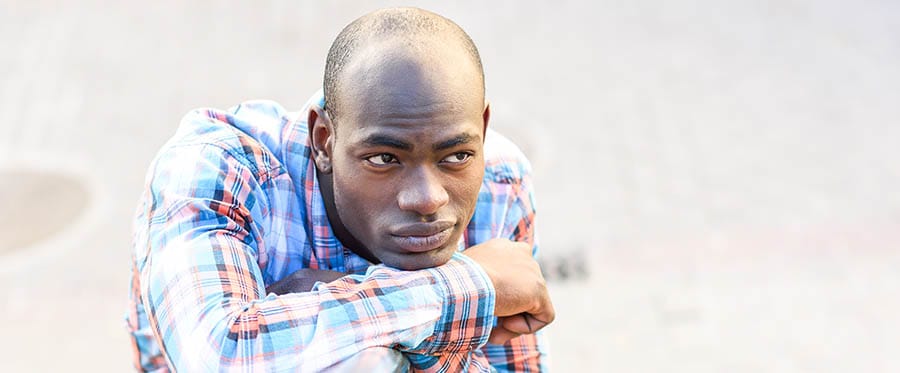 Black man wearing casual clothes in urban background